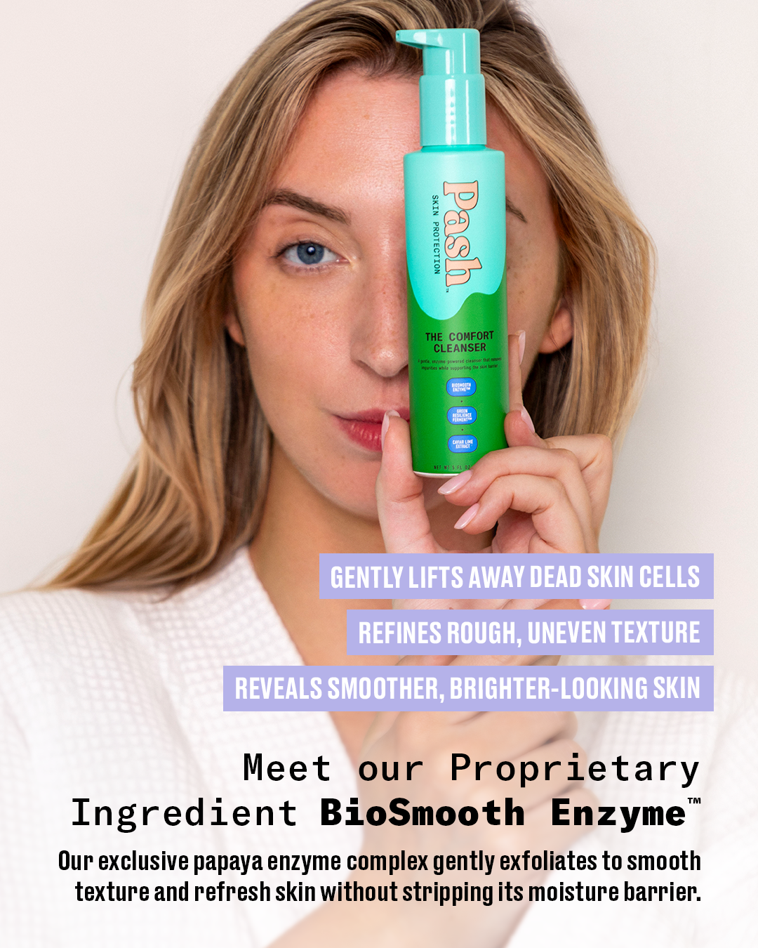 A woman holds a bottle of Pash The Comfort Cleanser against a light background, with promotional text overlays describing skincare benefits and the proprietary BioSmooth Enzyme ingredient.