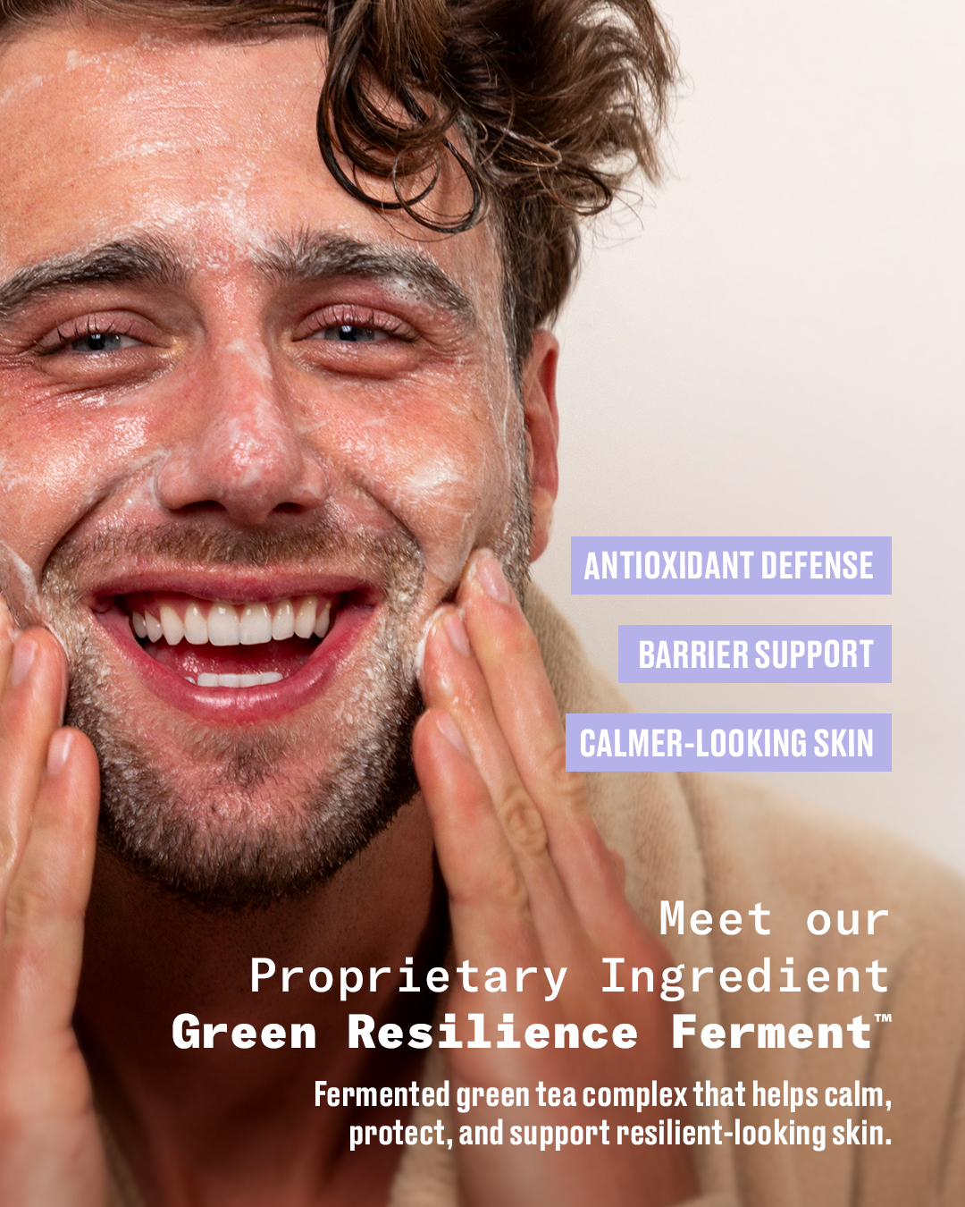 Close-up of a smiling Harry Jowsey with wet, foaming skin applying or washing his face, with overlaid marketing text reading 'Antioxidant Defense,' 'Barrier Support,' 'Calmer-Looking Skin,' and 'Meet our Proprietary Ingredient Green Resilience Ferment.' This is not a clean standalone product shot and not a measurement chart, swatch, or instruction diagram.